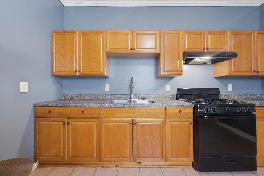 Kitchen sink with cabinet storage above and below