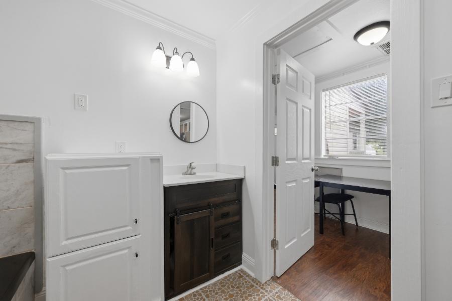 Bathroom vanity with doorway to the dining area